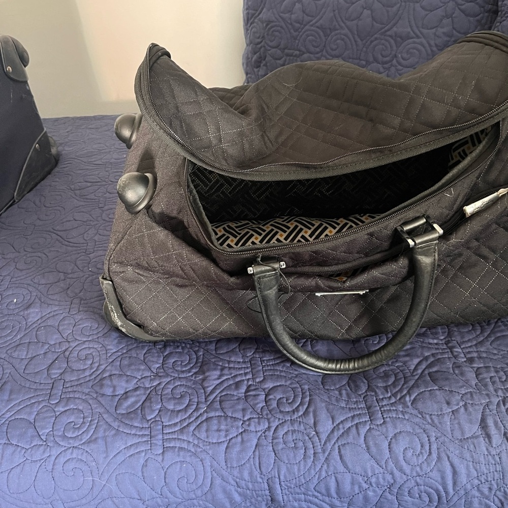Rolling duffle bag with wheels